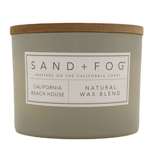 California Beach House candle with 'Sand + Fog' label on a white background