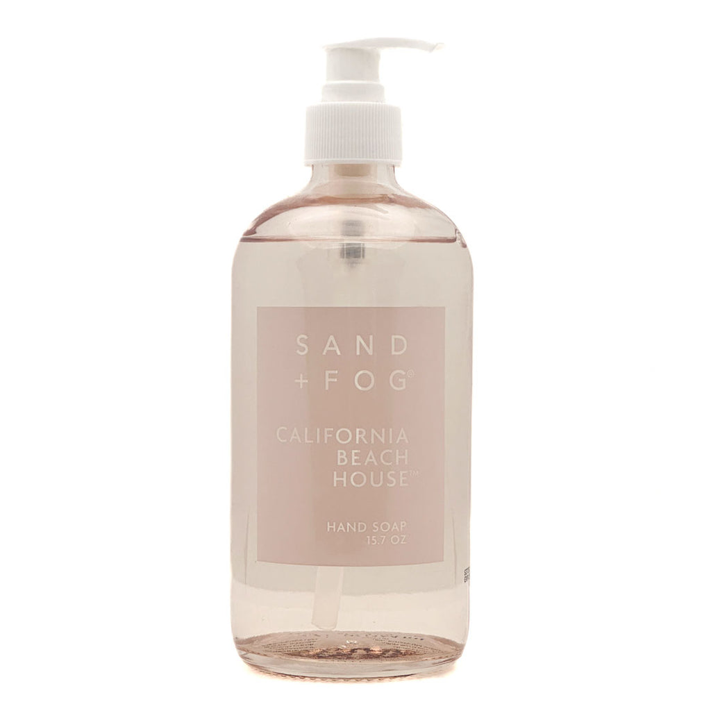 Hand soap bottle labeled 'Sand + Fog California Beach House' on a white background