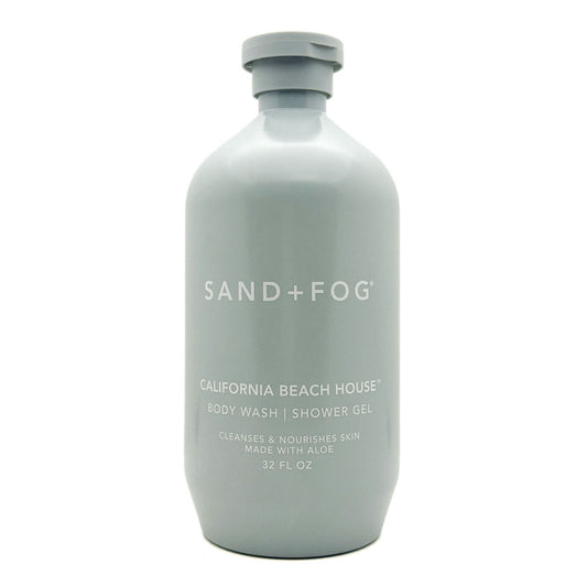 A 32 fl oz matte light gray bottle of Sand + Fog California Beach House body wash shower gel on a white background.