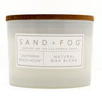 California Beach House candle with 'Sand + Fog' label on a white background
