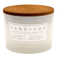 California Beach House candle with a wooden lid labeled 'Sand + Fog' on a white background