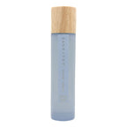 SAND + FOG California Beach House room spray bottle with wooden cap on a white background