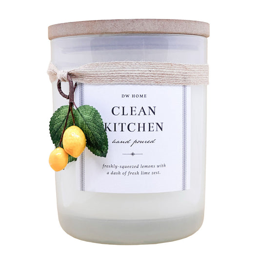 DW Home candle labeled 'Clean Kitchen' with lemon and leaf decorations on a white background