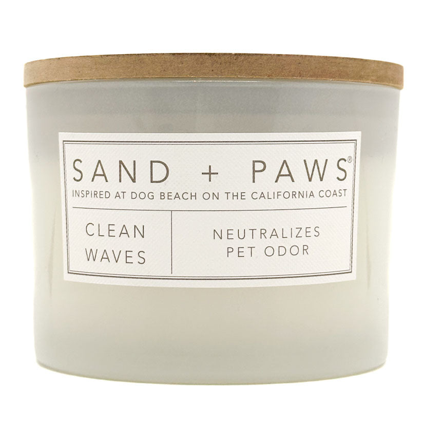 Clean Waves Candle with 'Sand + Paws' label on a white background