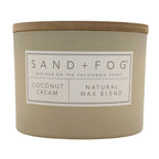 Coconut Cream Candle with 'Sand + Fog' label on a white background