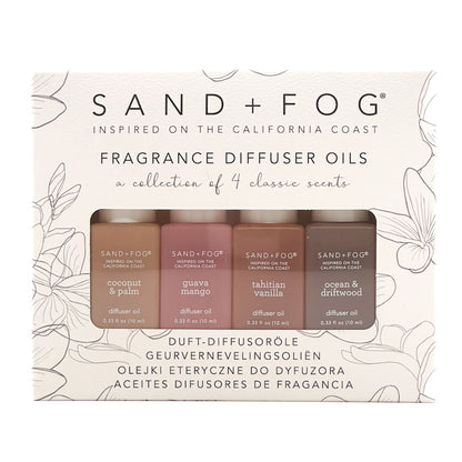 Sand + Fog fragrance diffuser oils with four bottles on a decorative background.