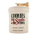 Dog treat candle jar labeled 'Cookies for Santa Paws' by Sand + Paws on a white background