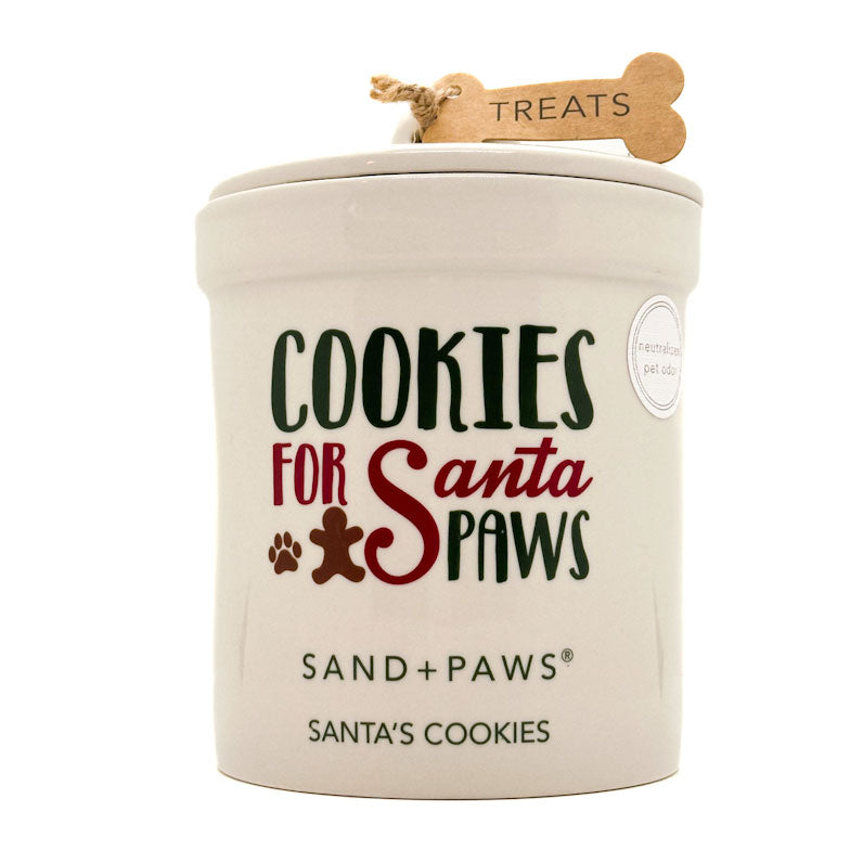 Dog treat candle jar labeled 'Cookies for Santa Paws' by Sand + Paws on a white background