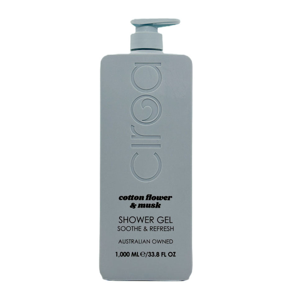 A 1000 mL bottle of Ciroa Cosmetics cotton flower & musk shower gel, featuring a matte light grey-blue bottle with a matching pump dispenser, set against a plain white background.