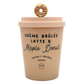 A beige insulated coffee cup with a lid, featuring a donut-shaped metal charm on top. The cup is printed with the text 'CRÈME BRÚLÉE LATTE & Maple Donut' and a 'DW Design' logo, on a solid white background.