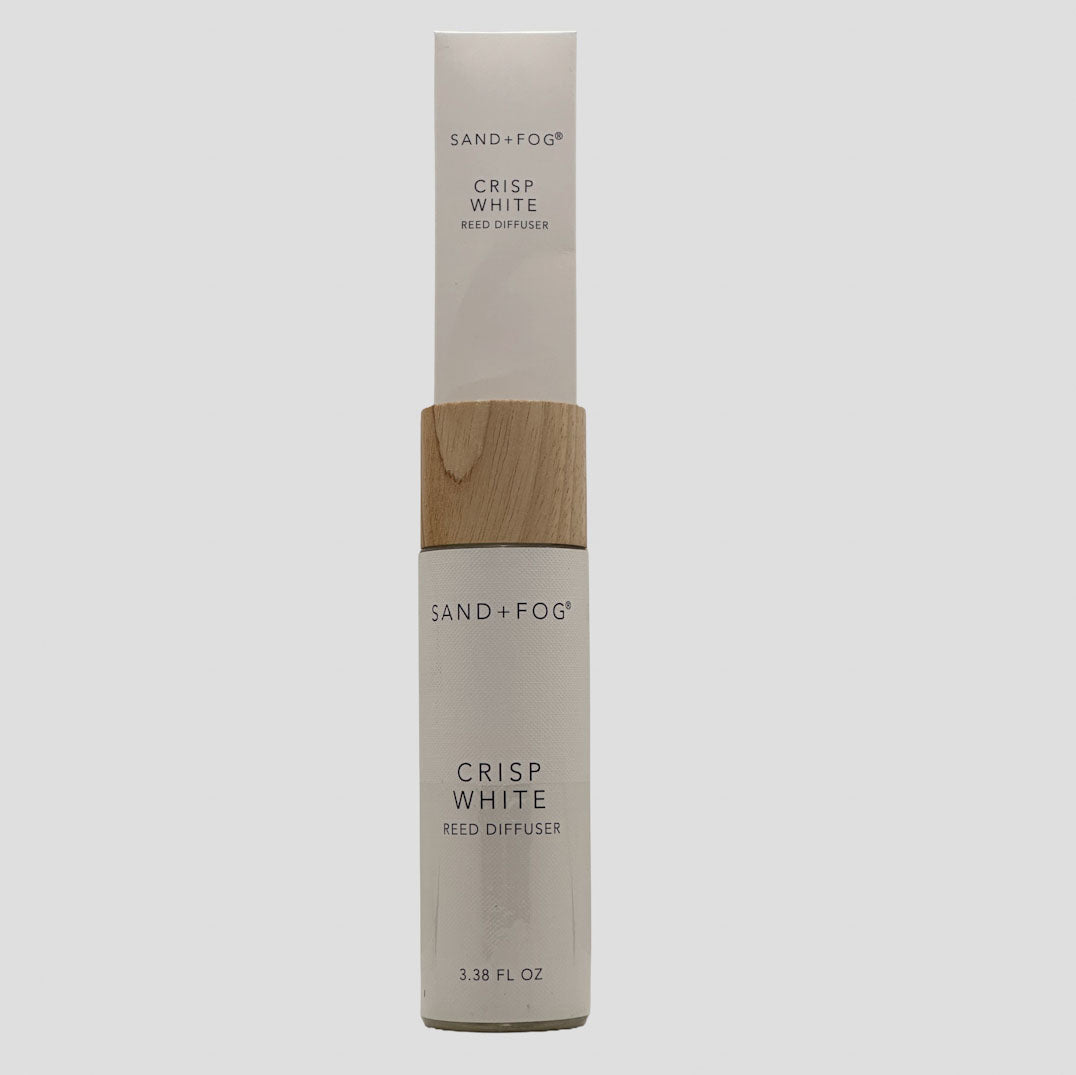 Sand + Fog crisp white reed diffuser packaging on a light gray background