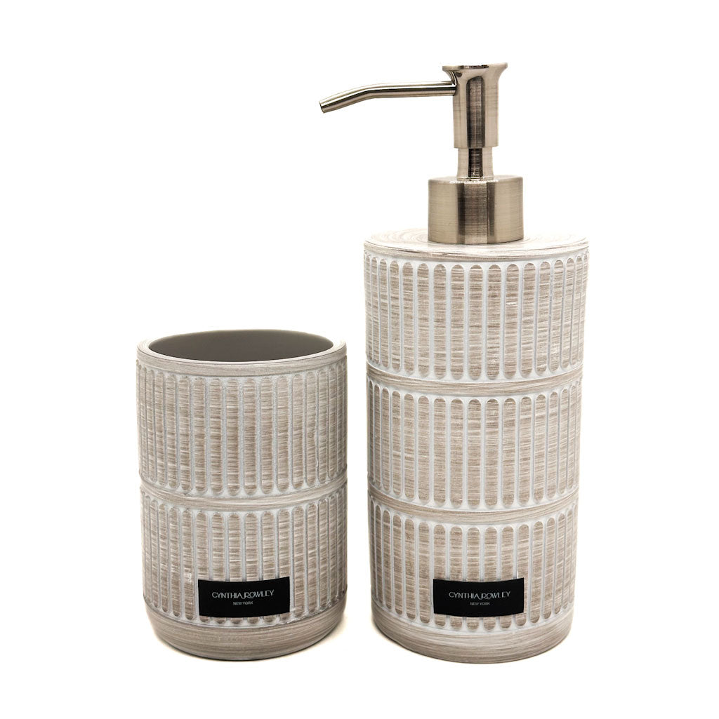 Ceramic bathroom set with dispenser and cup holder on a white background