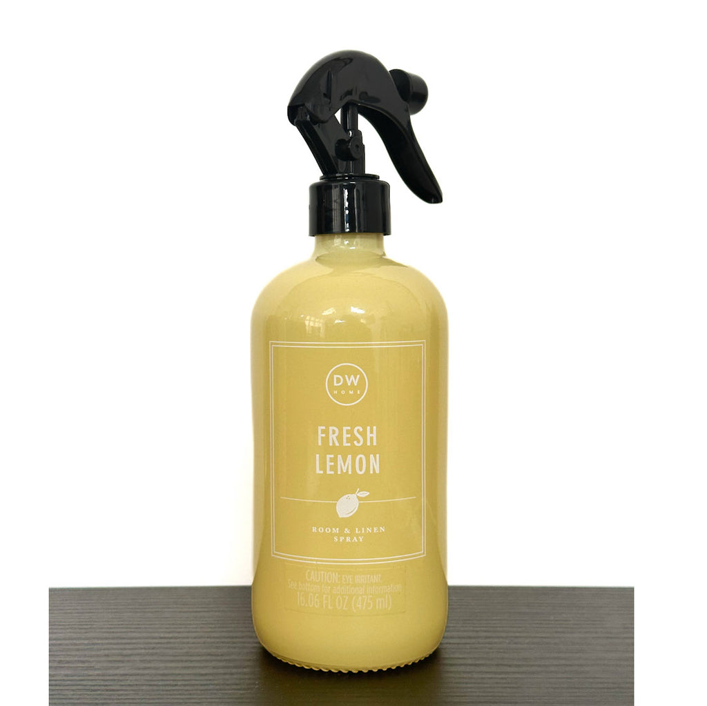 Yellow spray bottle labeled 'Fresh Lemon' on a white background