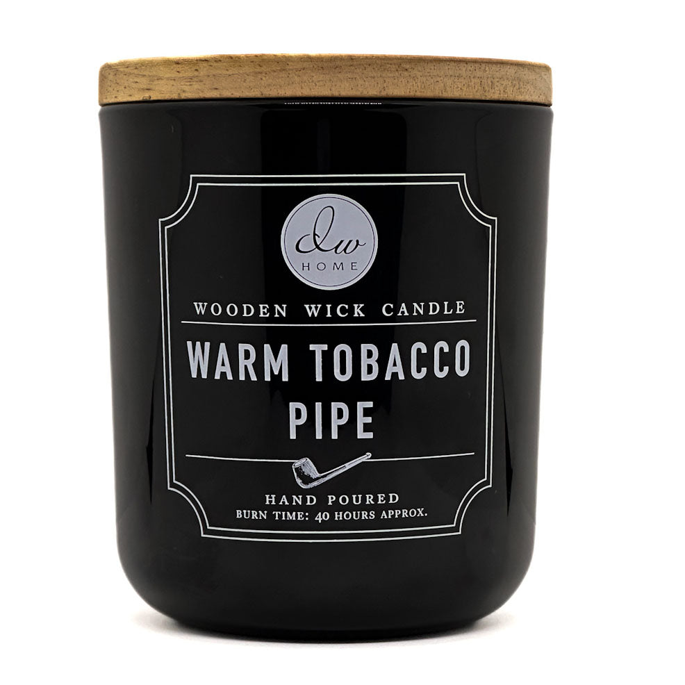 DW Home black candle with wooden lid labeled 'Warm Tobacco Pipe' on a white background