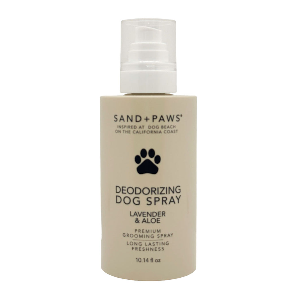 Deodorizing dog spray bottle with 'Sand + Paws' branding on a white background