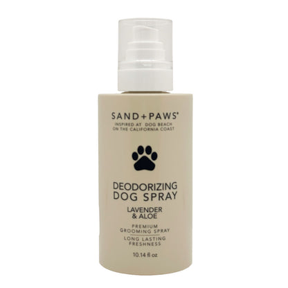 Deodorizing dog spray bottle with 'Sand + Paws' branding on a white background