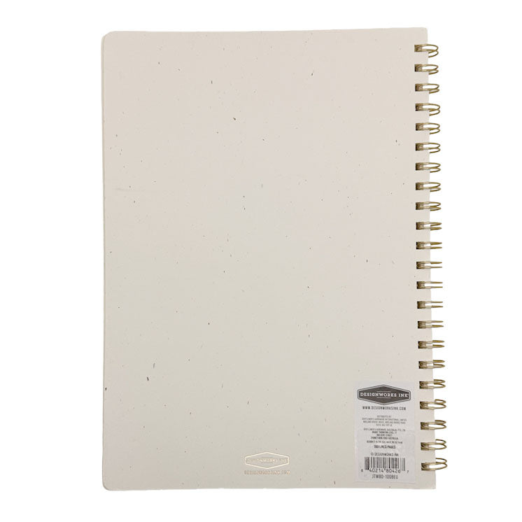 Beige notebook with gold spiral binding on a white background