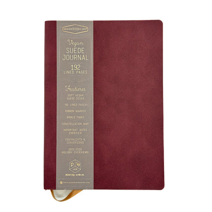 Maroon suede journal with gold text on a white background