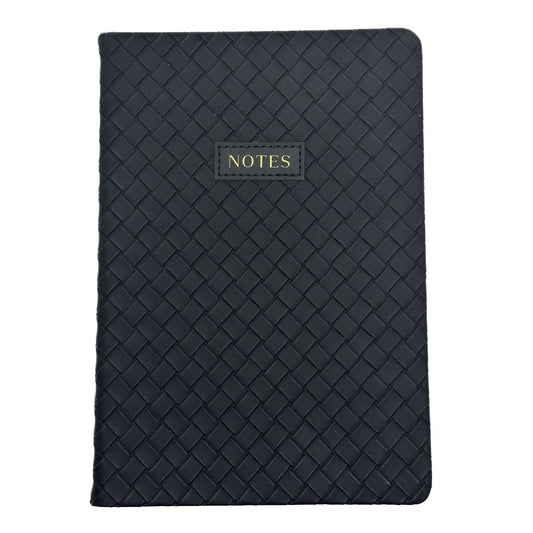 A black woven-texture notebook with a small gold-embossed label reading 'NOTES' on the front, shown against a plain white background.