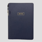 A navy blue textured hardcover notebook with a gold foil 'NOTES' label on the front, shown against a light gray background.
