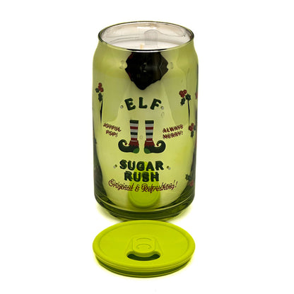 Green glass tumbler candle with elf design and text on a white background