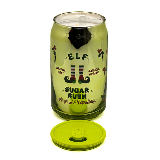 Green glass tumbler candle with elf design and text on a white background