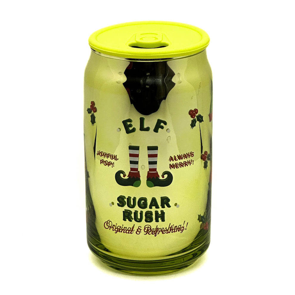 DW Home Green Sugar Rush can-shaped candle with yellow lid featuring an elf design and text on a white background