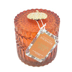 Enchante Pumpkin Spice Scentd Candle in an orange jar with a pumpkin on the lid