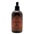 A 500 ml bottle of Tuscan Sandalwood Toning Shower Gel by Terrelio Scavo, featuring a dark amber-brown translucent bottle, a black pump dispenser, and a terracotta-colored label.