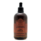 A 500 ml bottle of Tuscan Sandalwood Toning Shower Gel by Terrelio Scavo, featuring a dark amber-brown translucent bottle, a black pump dispenser, and a terracotta-colored label.
