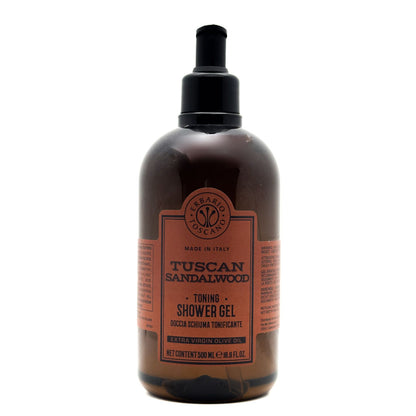 A 500 ml bottle of Tuscan Sandalwood Toning Shower Gel by Terrelio Scavo, featuring a dark amber-brown translucent bottle, a black pump dispenser, and a terracotta-colored label.