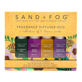 Packaging of Sand + Fog fragrance diffuser oils with four bottles on a yellow background
