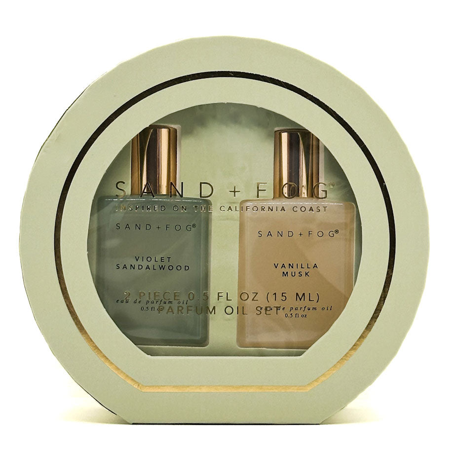 SAND + FOG Perfume oil discovery set in a circular display case with 'Sand + Fog' branding.