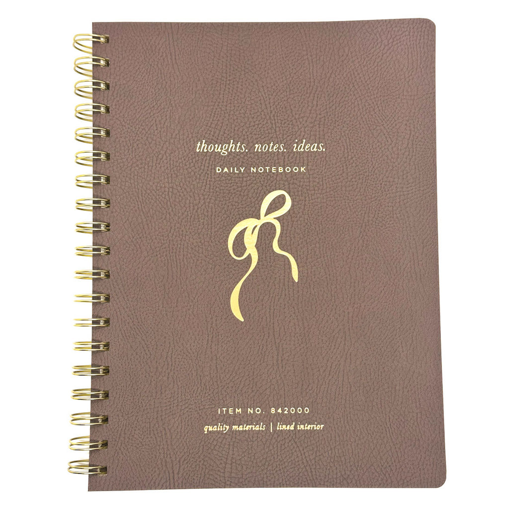 FRINGE brown notebook with gold spiral binding and decorative bow design on a white background