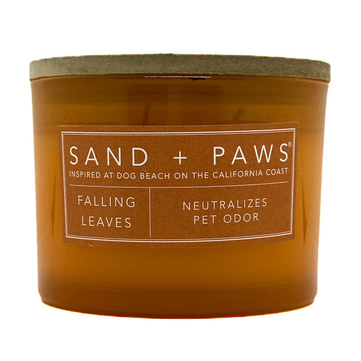 Falling Leaves brown candle with 'Sand + Paws' label on a white background