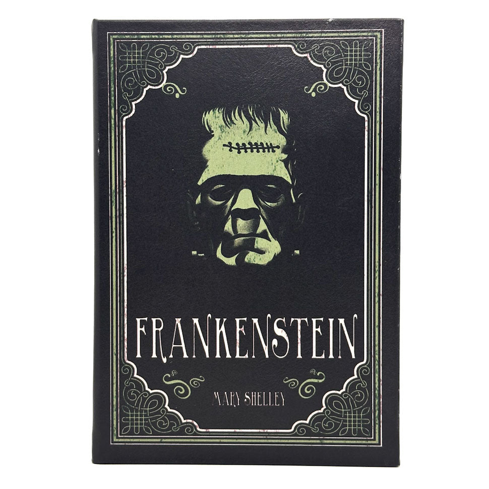 A black book cover featuring a stylized green and white illustration of Frankenstein's monster head, with the title 'FRANKENSTEIN' 