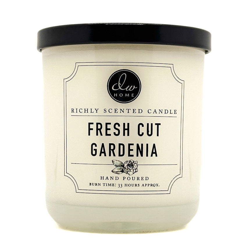 Candle with a label indicating 'Fresh Cut Gardenia' fragrance on a white background