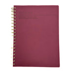 Fringe Studio Burgundy notebook with gold spiral binding on a white background