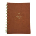 Fringe Studio brown loft leather notebook with gold spiral binding on a white background
