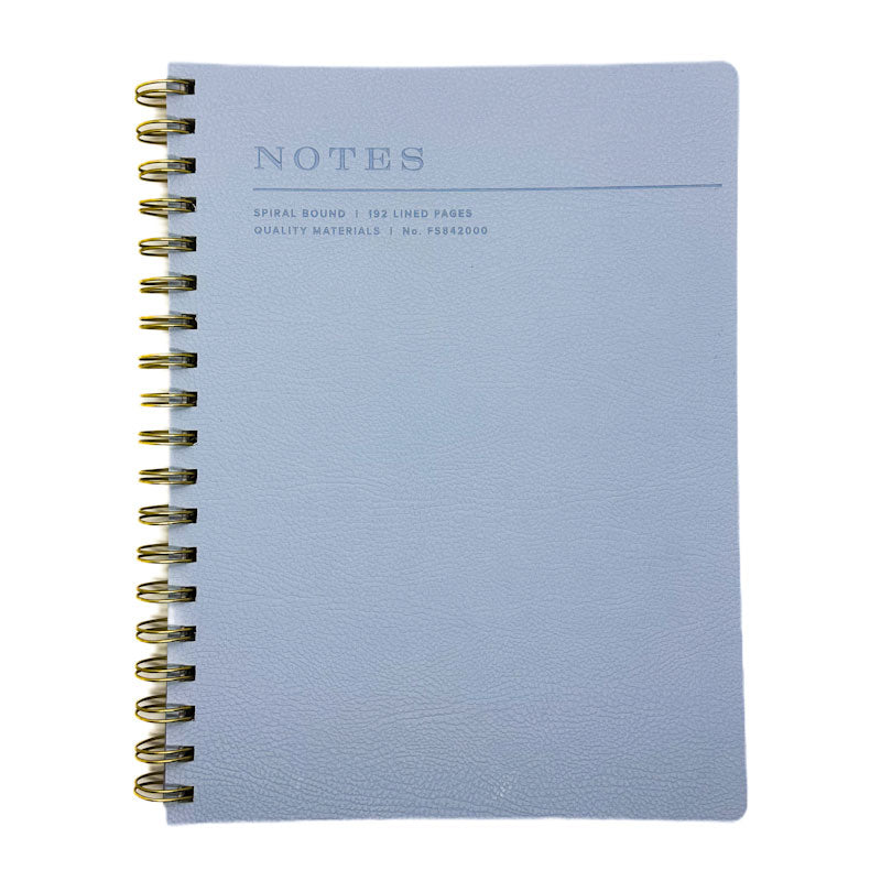 Fringe Studio blue soft leather notebook with gold spiral binding on a white background