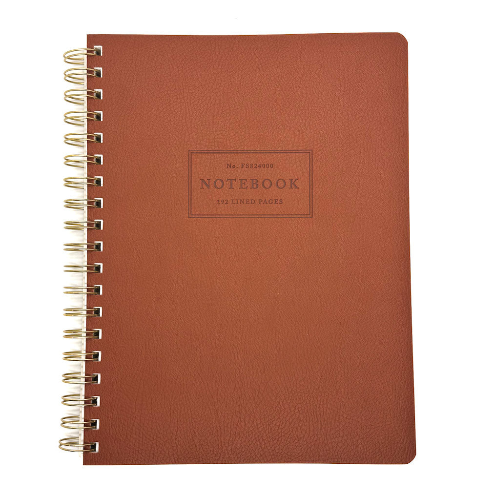 Brown notebook with gold spiral binding on a white background