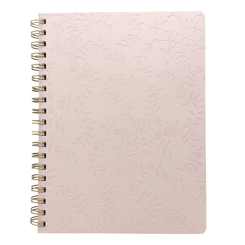 A pale pink spiral-bound notebook with an embossed floral pattern on the cover, shown against a plain white background.