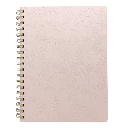 A pale pink spiral-bound notebook with an embossed floral pattern on the cover, shown against a plain white background.