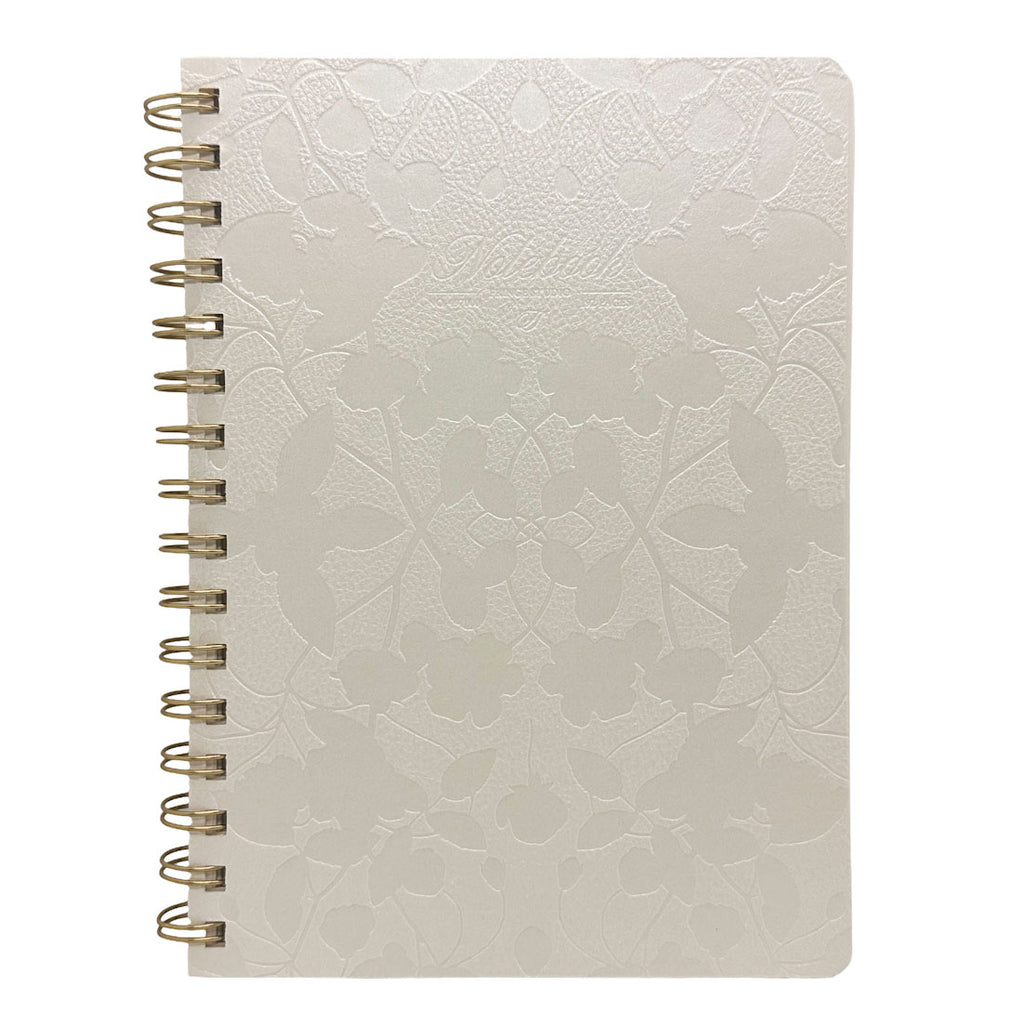 Fringe Studio A5 Ivory textured notebook with gold spiral binding on a white background