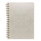 Fringe Studio A5 Ivory textured notebook with gold spiral binding on a white background