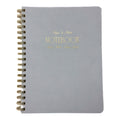 Fringe Studio blue notebook with gold spiral binding and 'Notebook' text on a white background