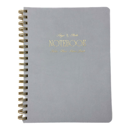 Fringe Studio blue notebook with gold spiral binding and 'Notebook' text on a white background