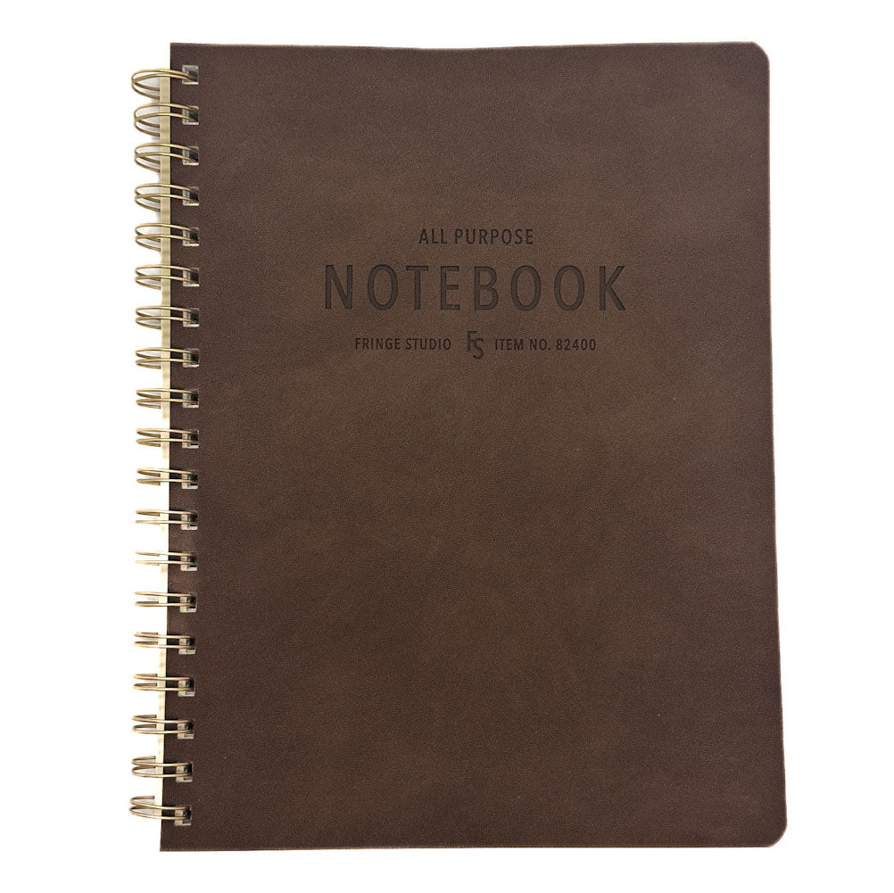 A dark brown textured notebook with a gold spiral binding on the left side, featuring embossed text that reads 'ALL PURPOSE NOTEBOOK' and 'FRINGE STUDIO' on the cover, set against a plain white background.