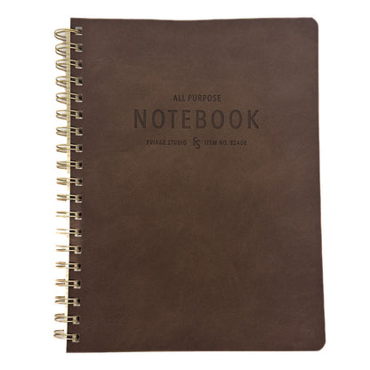 A dark brown textured notebook with a gold spiral binding on the left side, featuring embossed text that reads 'ALL PURPOSE NOTEBOOK' and 'FRINGE STUDIO' on the cover, set against a plain white background.