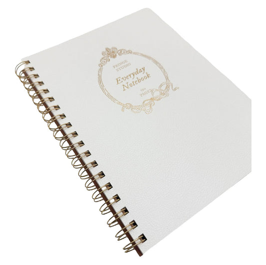 A white spiral-bound notebook with a gold foil stamp on the cover reading 'Everyday Notebook' inside an ornate frame, shown on a plain white background.